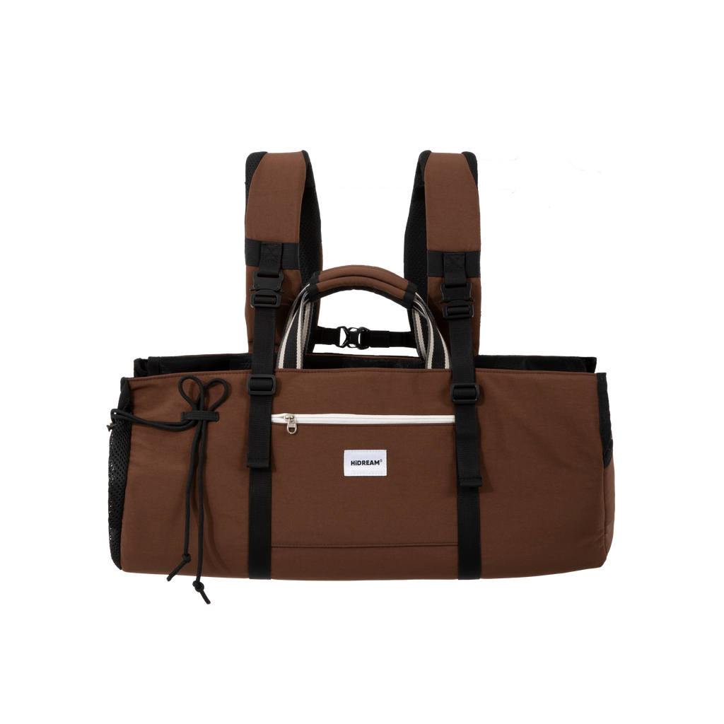 A brown Dachshund carrier backpack with black straps and buckles, featuring a top handle, shoulder straps, and a front zippered pocket with a white brand label.