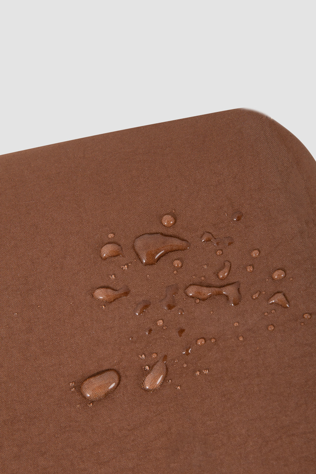 Brown surface with water droplets