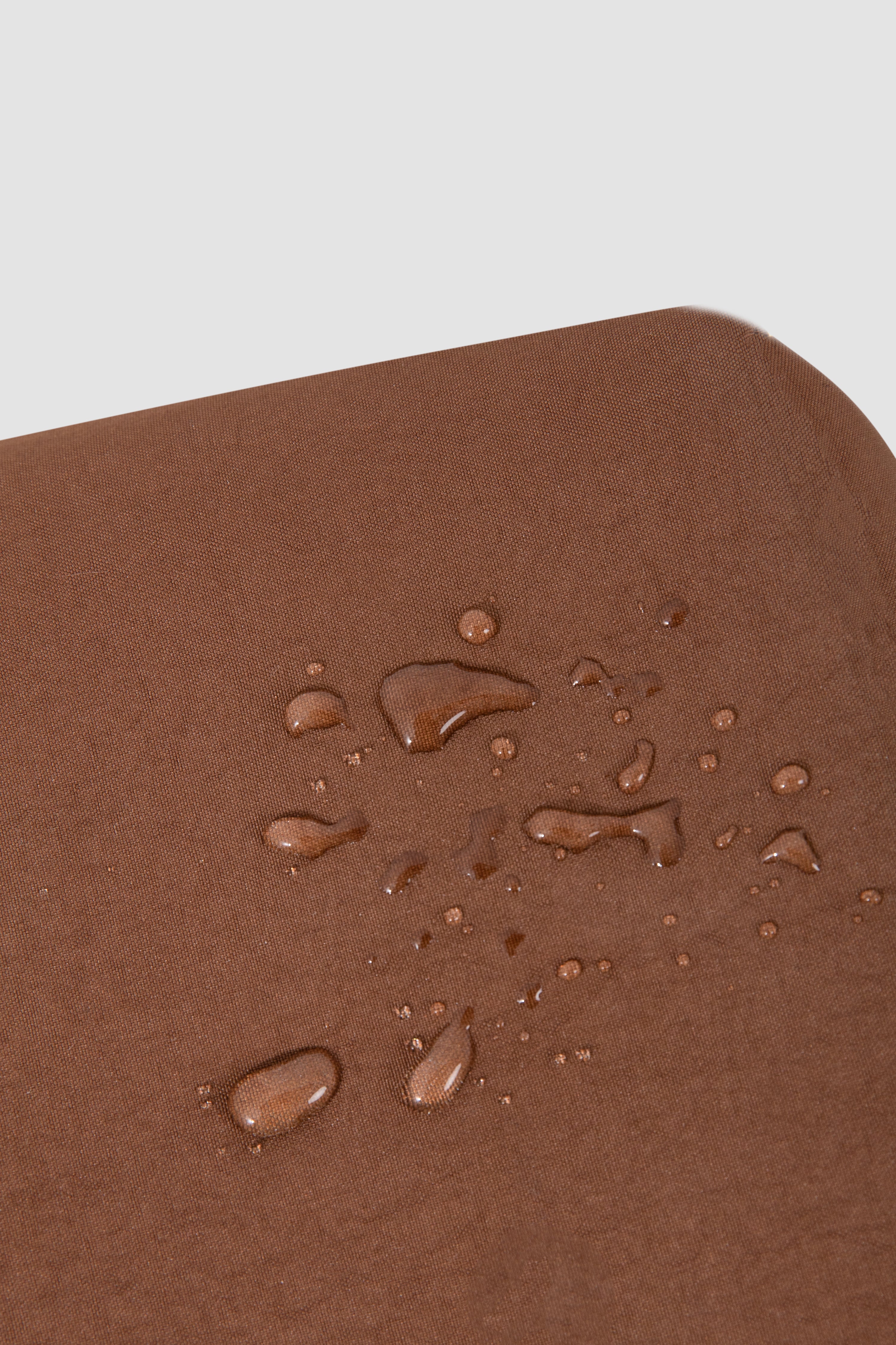 Brown surface with water droplets