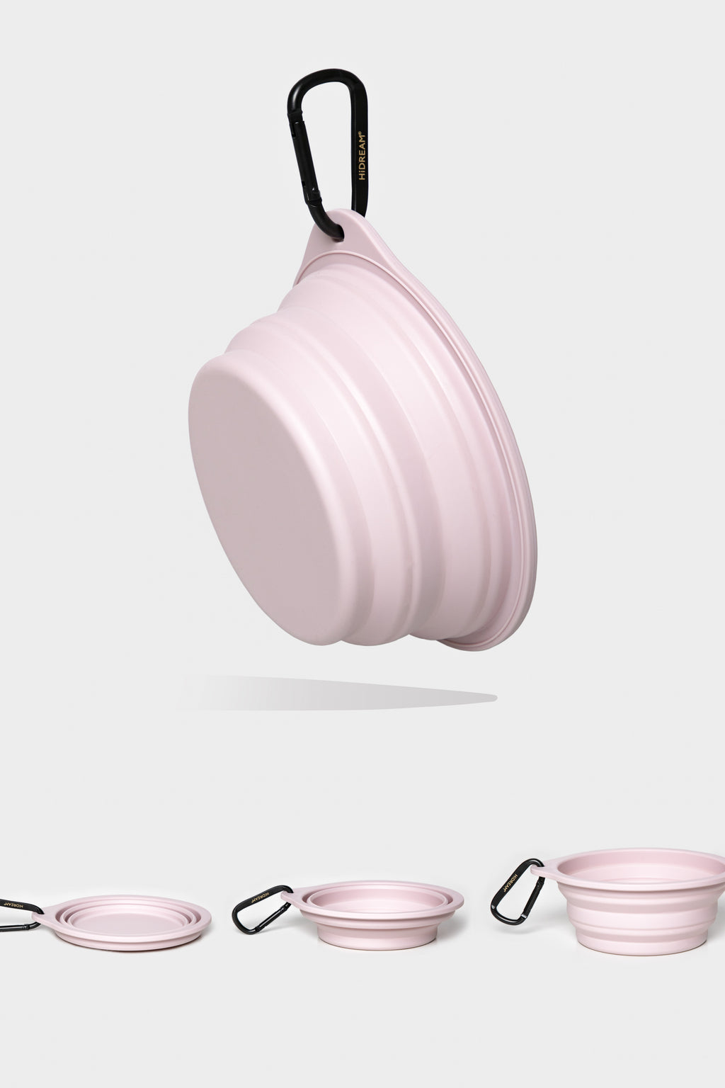 A light pink collapsible silicone bowl with a black carabiner clip, shown floating above three smaller views at the bottom that show different angles and the flat folded state on a light gray background.