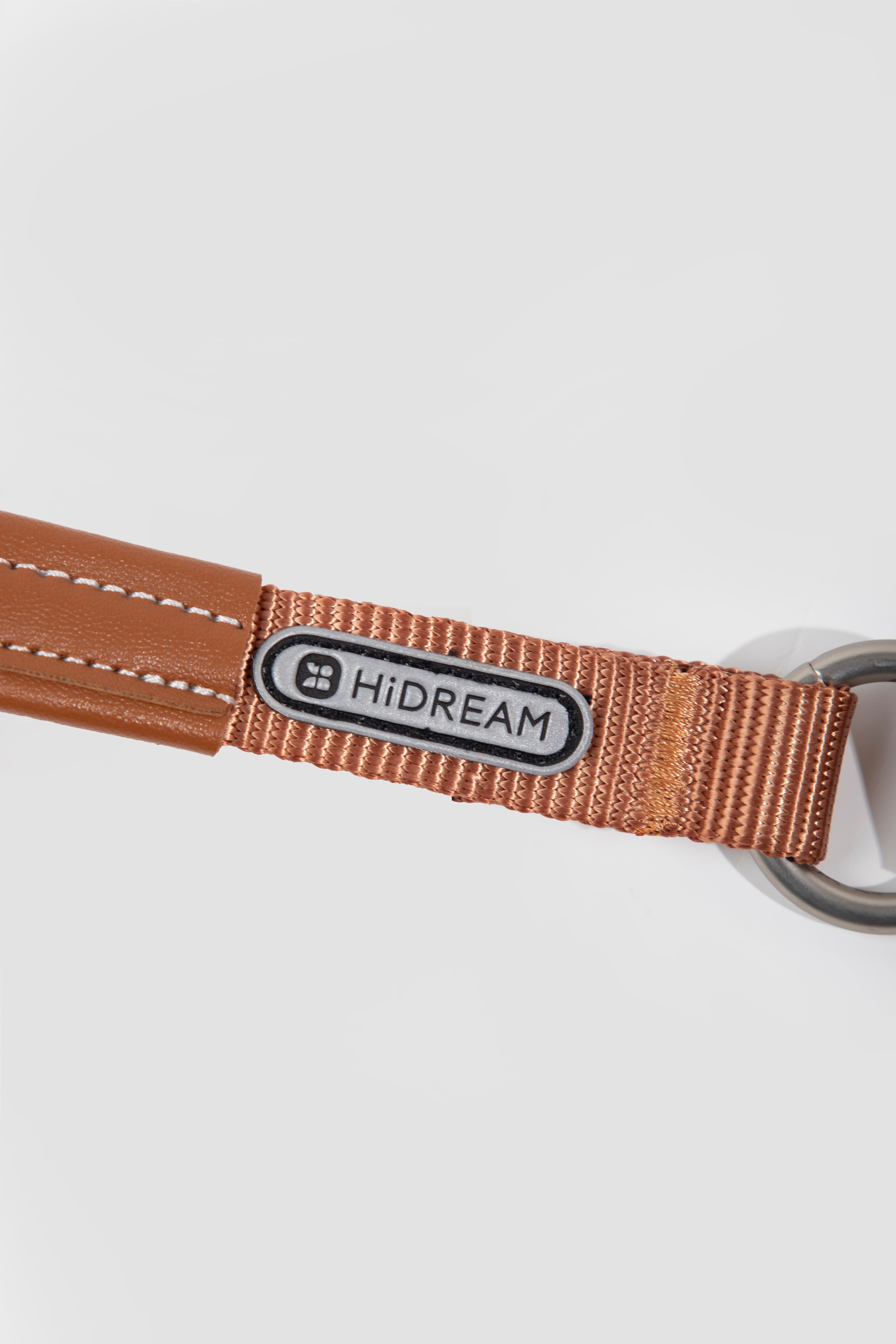 Brown dog leash with a HiDREAM label on a white background
